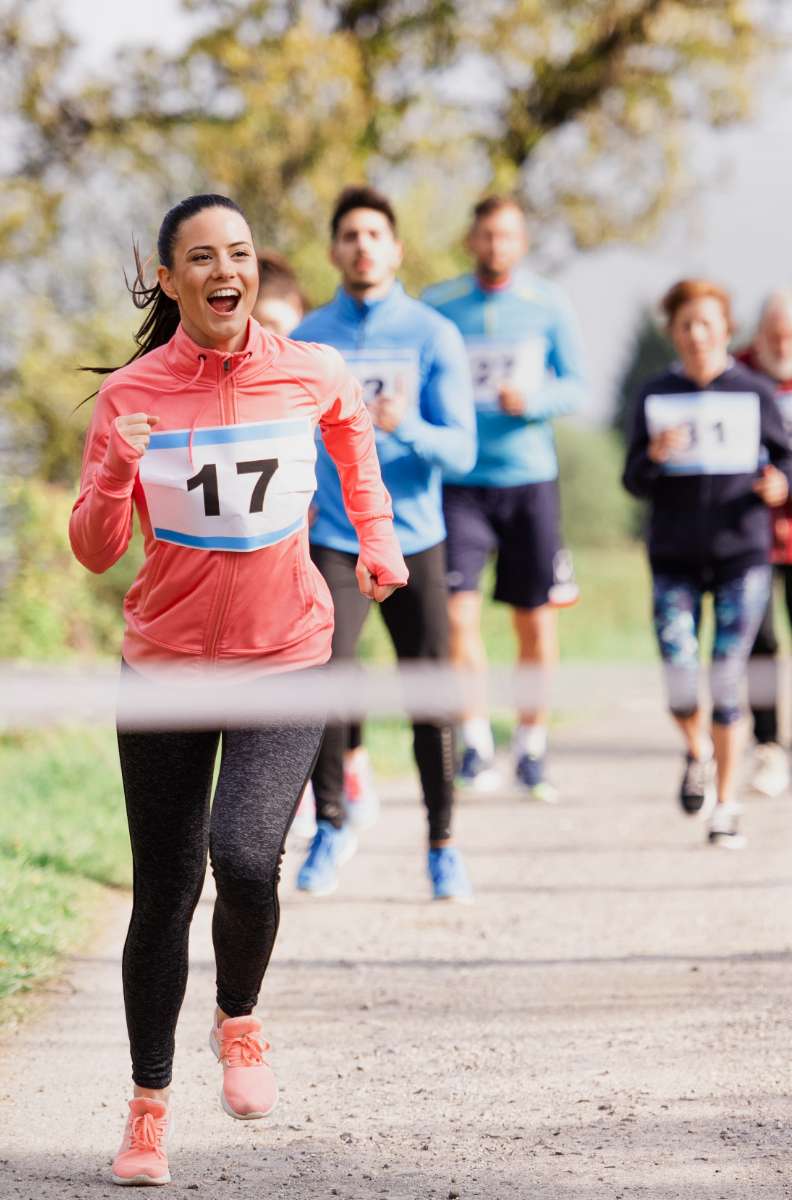 people approaching the finish line of a race