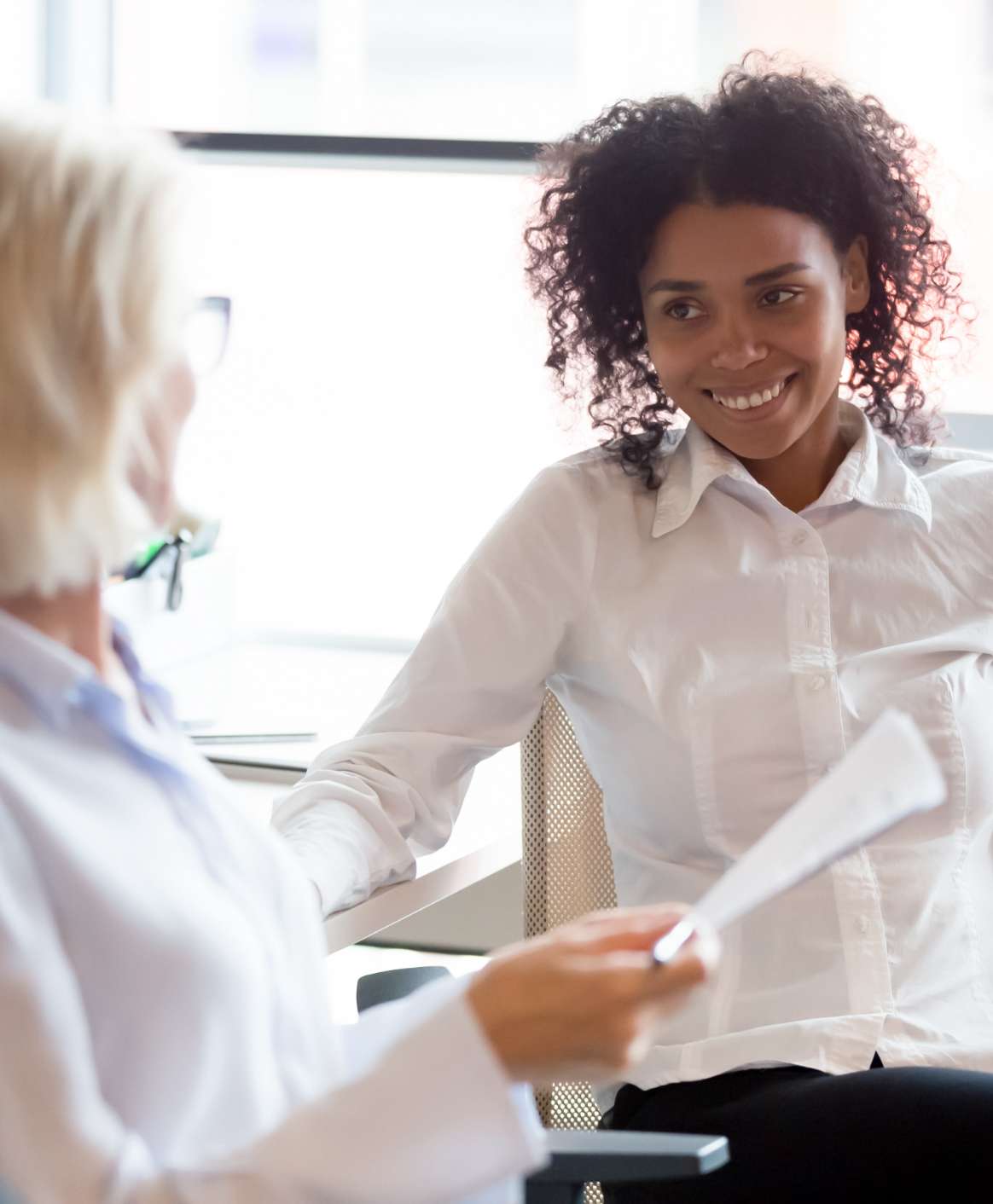 two people talking in an office